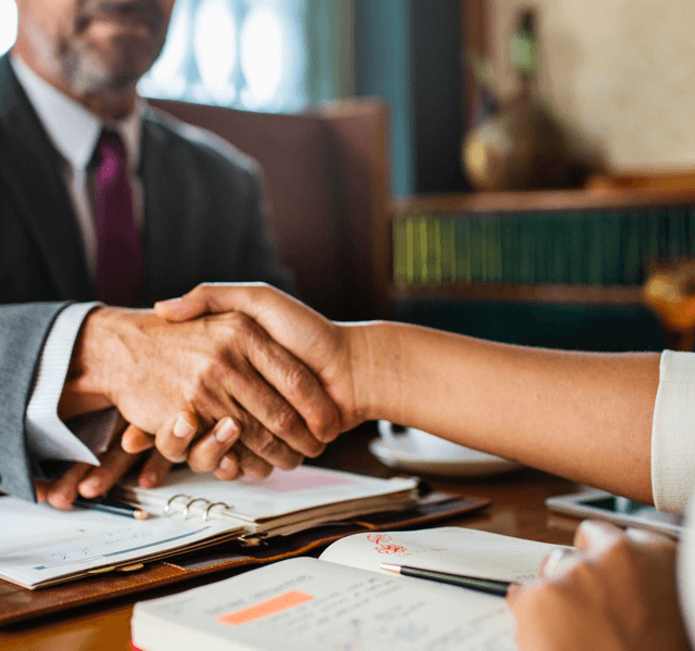 shaking hands in a law firm