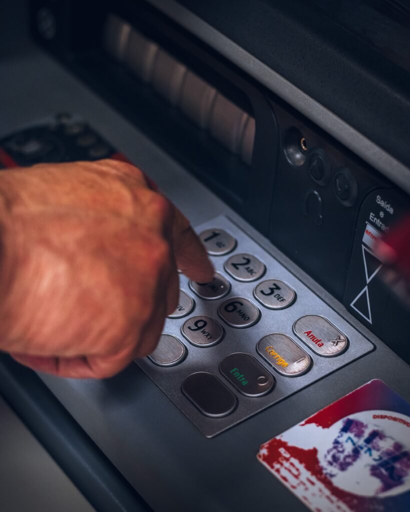 a man using atm machine